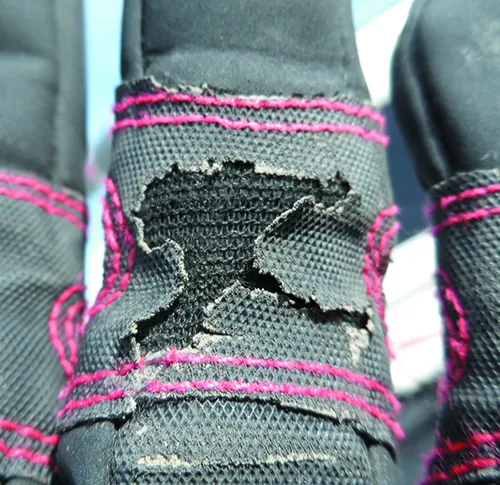 close up of Mustos glove wear