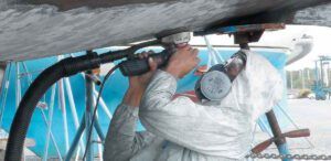 When sanding bottom paint,use only NIOSH-rated high efficiency filters (see “The Best Respirators for the Boatyard,” Practical Sailor September 2017). Do not use disposable fabric masks—they do not provide the same level of protection. Goggles and a hood further increases protection, but they can be hard to bear if it is hot