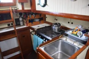 The lack of creature comforts like refrigeration and pressure water makes for a low-maintenance galley. (Photo/ Bert Vermeer)