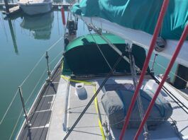 A helpful view of the jackline leading around the dodger to a hard point on top of the coach roof, and from there forward to the base of the mast.