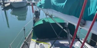 A helpful view of the jackline leading around the dodger to a hard point on top of the coach roof, and from there forward to the base of the mast.