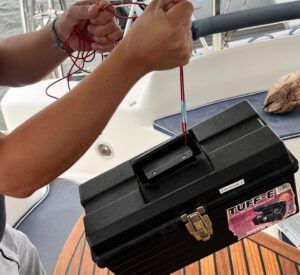 Lifting a heavy toolbox with a crimped wire. (Photo/ Adam Morris)