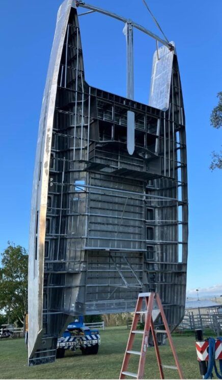 Stradbroke 52, designed by DeVilliers Marine Design. Stradbroke Yachts writes, "You know it’s built tough when it can dangle from it’s crossbeam." 