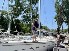 The crew at Hop-O-Nose Marina in Catskill, NY helped us remove our mast. They also helped us build cradles on the deck so that we could carry our mast and rigging on deck as we traveled the Erie Canal. (Photo/ Alison Major)
