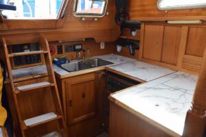 The easy-access U-shaped galley keeps everything within reach. Lady Jane's galley is updated with new counter laminate, cold-plate refrigerator system and a gimbaled Force 10 stove. (Photo/ Bert Vermeer)