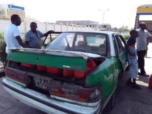 Four men in Djibouti who drove Amanda in a taxi to fill the diesel jerry cans at the local gas station. (Photo/ Brett Campbell)