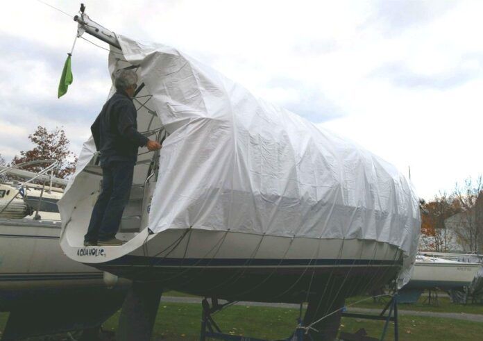 Covering the boat is one of the last steps in the winterizing process which readies all of your boat systems for the coming temperature drop. (Photo/ Marc Robic)