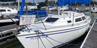 sailboat vs fishing boat hauling nets