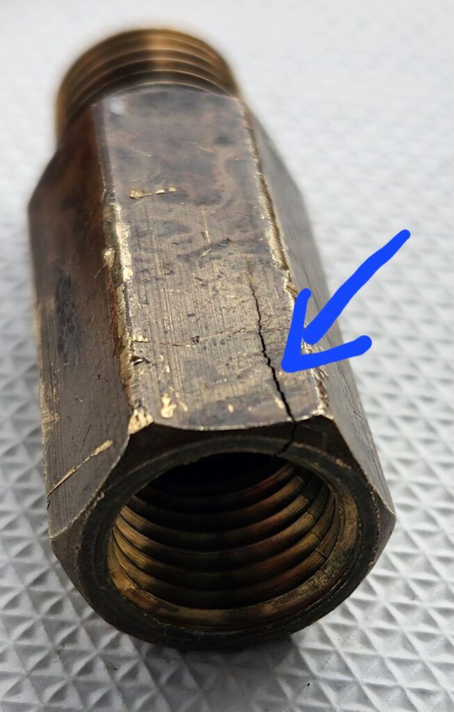 This hairline fracture in the extension fitting was not visible from the top. Once all of the components were taken apart and inspected, it was clear this part needed replacing. However, it turned out to be an unnecessary extension, there was enough room between the tank and the valve. So after replacing the teflon tape on the various threads, the assembly was redone without the extension piece. (Photo/ Marc Robic)