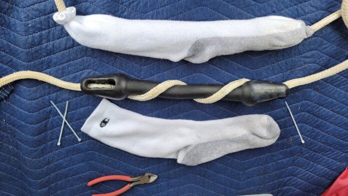 Mooring line with shock absorbers and sock sleeves. Plain, white socks keep the shock absorbers from marking your hull. (Photo/ Marc Robic)