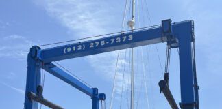 This flight in the travel lift from the water to the stands cost at Brunswick Landing Marina cost $814 with a pressure wash of the bottom included. (Photo/ Alex Jasper)