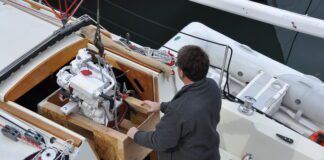 Lowering the Beta 20, the Kubota 722 block marinized by the British, to replace a Volvo MD7A two-cylinder. (Photo/ Bert Vermeer)