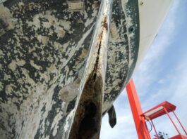 Although the cause of this delaminated rudder is unknown, In most cases the delamination comes with age. Also, a small nick from hitting a rock or coral will let water in and, if not attended too, the delamination will worsen in time. (Photo/ Ray Quenville)